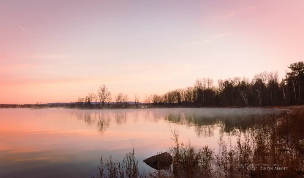 © 2015 Thousand Word Images by Dustin Abbott It was a frosty sunrise this morning. The day broke crisp and cold, with the temperature hovering around -7C/20F, but I saw the development of beautiful light. Mist rose off the water that is still a lot warmer than the air, and the color was dazzling. It was until I shot my fill that I began to notice the cold at all. This is a four shot panorama combining four vertical frames. I like to shoot vertical frames for a panorama because you end up with a more natural framing after combining, although I also shot a horizontal pano that looks pretty sweet as well. I've always loved this wedge of trees out on the penninsula - it reminds me of a ship sailing off towards the horizon. Technical Information: Canon EOS M3, Canon EF 40mm f/2.8 STM, Processed in Adobe Lightroom CC, Photoshop CC, and Alien Skin Exposure X (use code "dustinabbott" to get 10% off) Want to know more about me or make contact? Take a look at my website and find a lot of ways to connect and view my work.